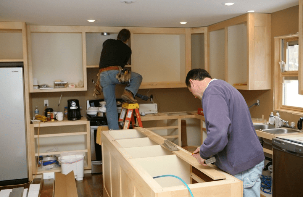 2 men doing kitchen remodeling