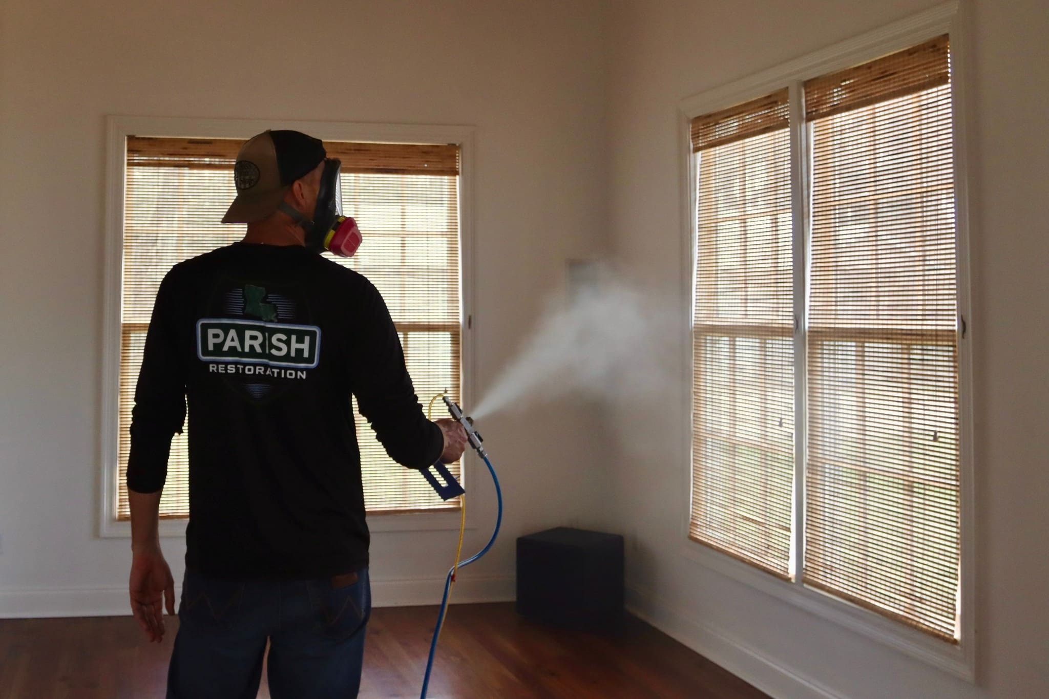 Parish-employee-fogging-with-back-to-camera
